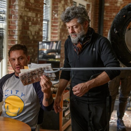 Tom Hardy on set as Eddie Brock, with director Andy Serkis, in Venom: Let There Be Carnage.