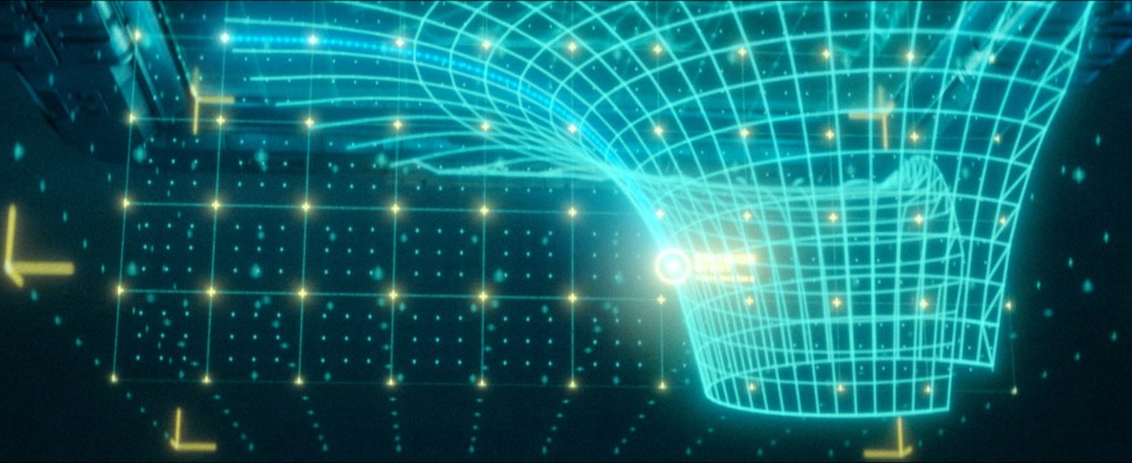 Ryan Wieber created the hologram using Adobe After Effects, combining motion graphics with CG set elements in order to integrate the display into the live-action plates. Hologram close-ups were fully digital.