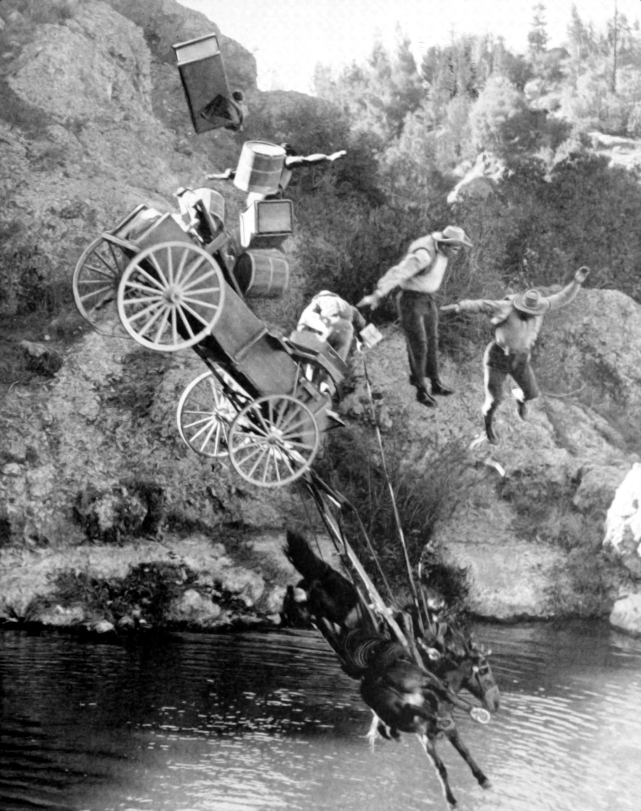 Four men, two horses and a wagon were half-way down a seventy-five foot drop when they were “stopped” in this spectacular shot by Joe Walters, member of Local 659, IATSE, during filming of Republic Studios’ “The Dark Command.” Ingenious devices were rigged up to accomplish this stunt and ingenious plans were laid by camera crews to record the event – original caption from “The International Photographer,” April 1940.